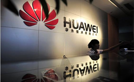 A receptionist sits behind the counter at the Huawei office.